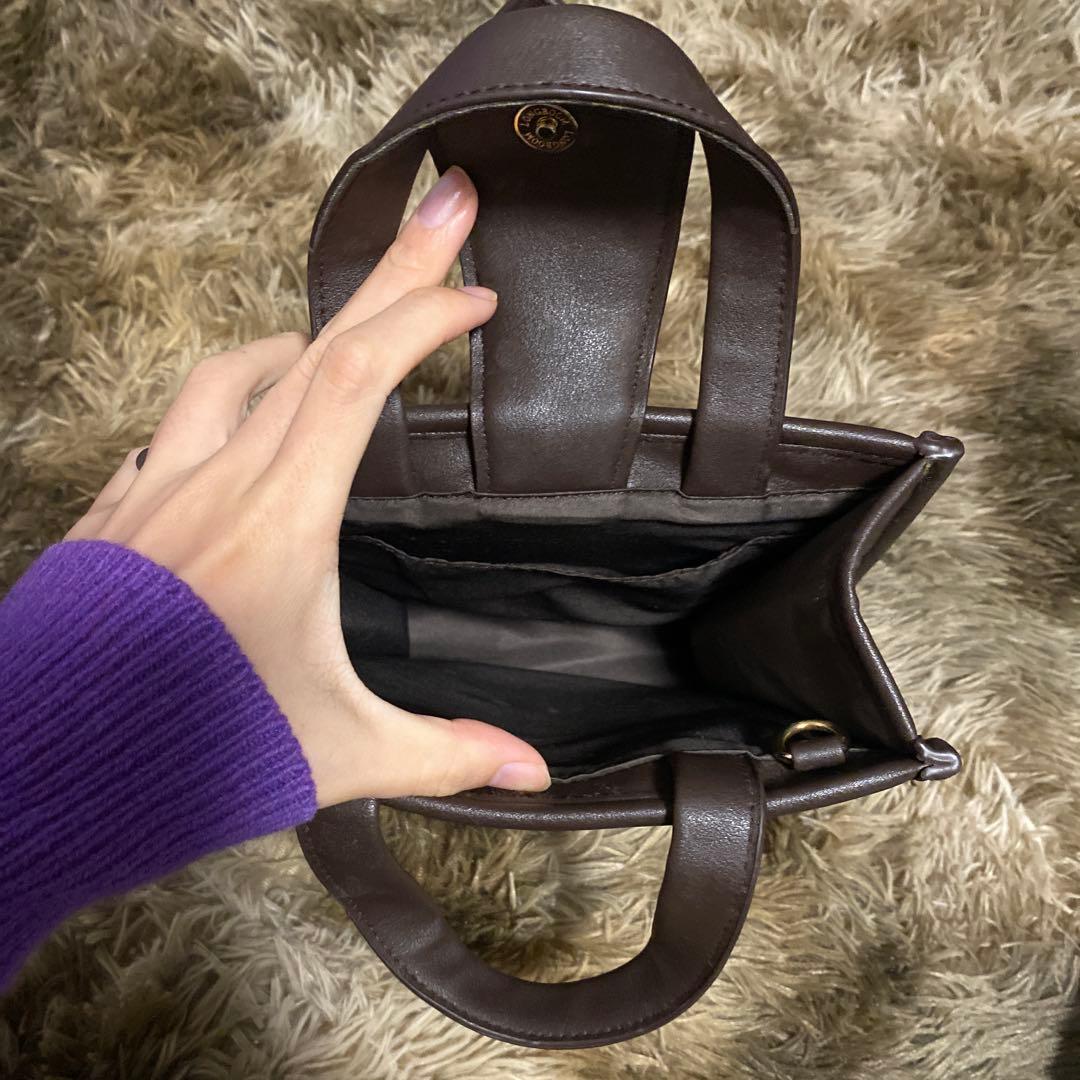 緑と茶色のハンドバッグ — image 4