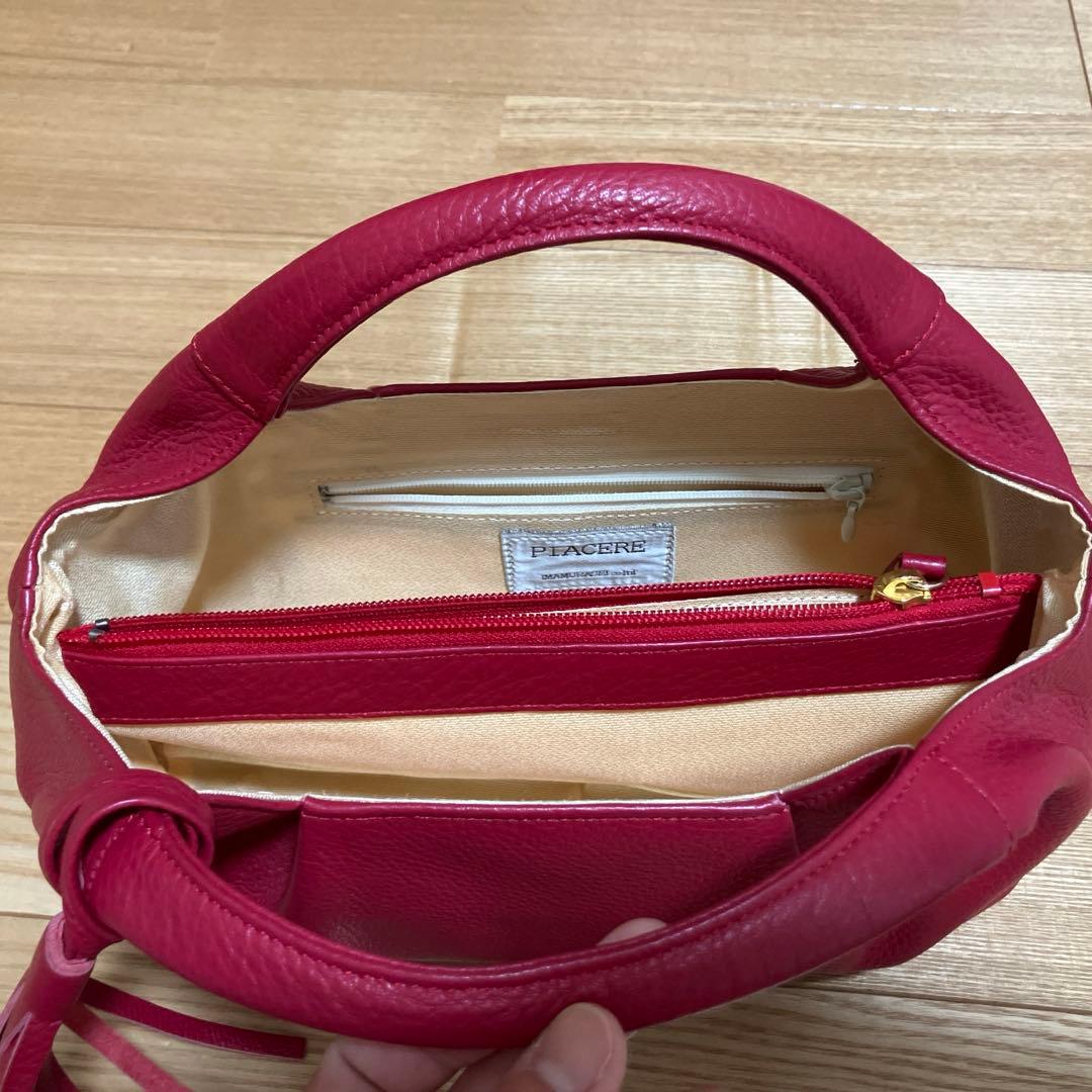 piacere ピアチェーレ　　レザー ハンドバッグ タッセル付き — image 3