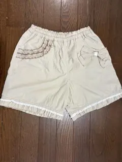 ニットプランナーのフリルとリボン付き ベージュ ハーフパンツ — image 1